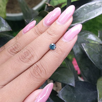 0.55 Ct. Bluish Green Sapphire from Madagascar Life Style