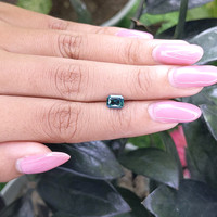 0.96 Ct. Bluish Green Sapphire from Madagascar Life Style