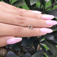 1.12 Ct. Greenish Brown Sapphire from Madagascar Life Style