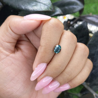 1.58 Ct. Bluish Green Sapphire from Madagascar Life Style