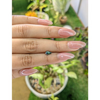 0.66 Ct. Green Sapphire from Madagascar Life Style