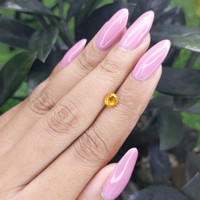 0.80 Ct. Orangish Yellow Sapphire from Madagascar Life Style