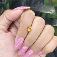 0.80 Ct. Orangish Yellow Sapphire from Madagascar Life Style