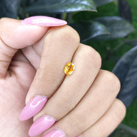 0.69 Ct. Orangish Yellow Sapphire from Madagascar Life Style