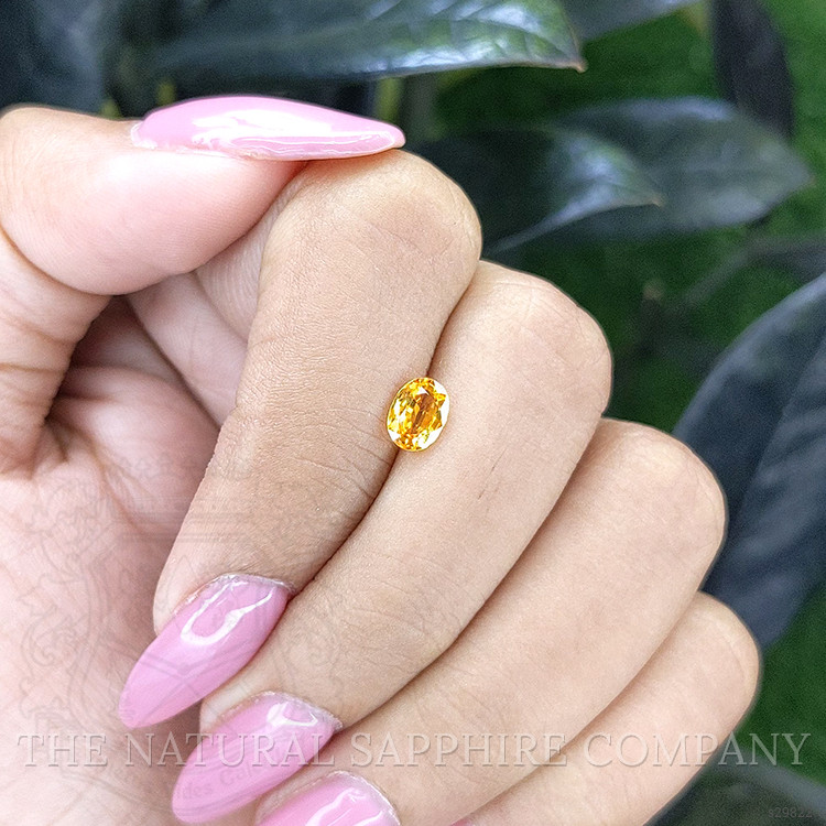0.69 Ct. Orangish Yellow Sapphire from Madagascar