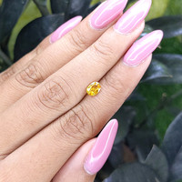 0.69 Ct. Orangish Yellow Sapphire from Madagascar Life Style