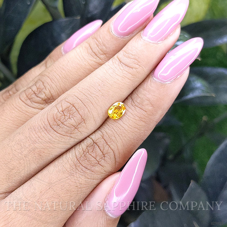 0.69 Ct. Orangish Yellow Sapphire from Madagascar