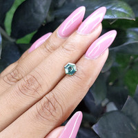 0.97 Ct. Bluish Green Sapphire from Madagascar Life Style