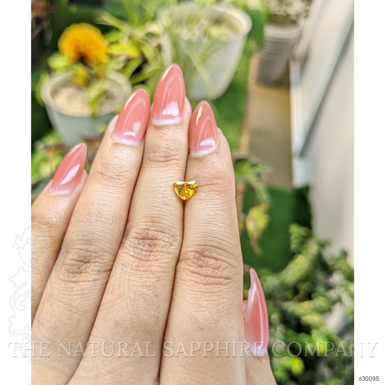 0.97 Ct. Orangish Yellow Sapphire from Ceylon (Sri Lanka)