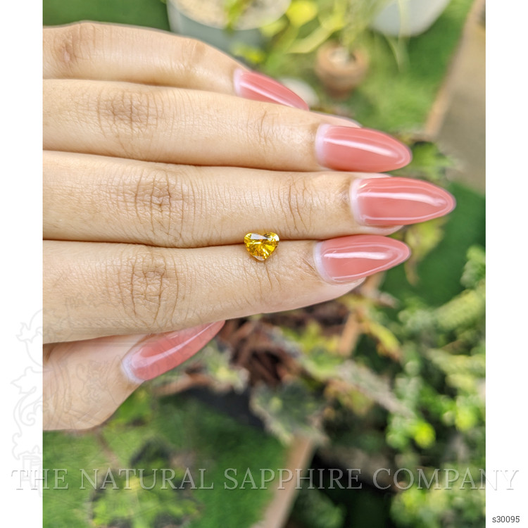 0.97 Ct. Orangish Yellow Sapphire from Ceylon (Sri Lanka)