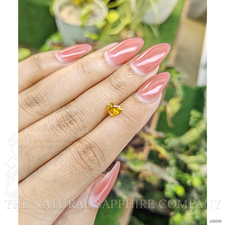 0.97 Ct. Orangish Yellow Sapphire from Ceylon (Sri Lanka)