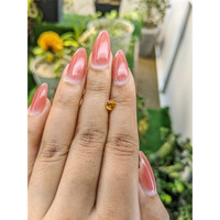 0.58 Ct. Yellowish Orange Sapphire from Ceylon (Sri Lanka) Life Style
