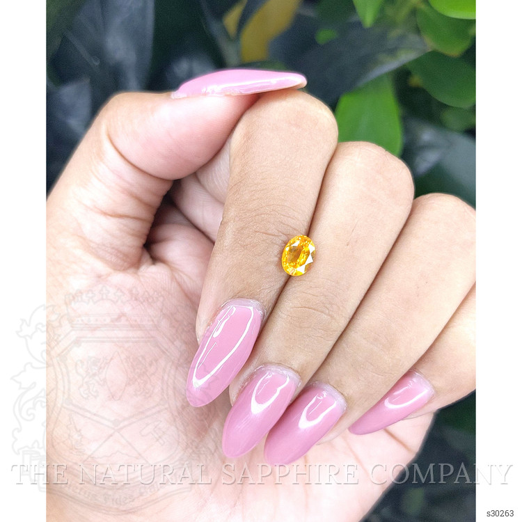 0.94 Ct. Orangish Yellow Sapphire from Ceylon (Sri Lanka)