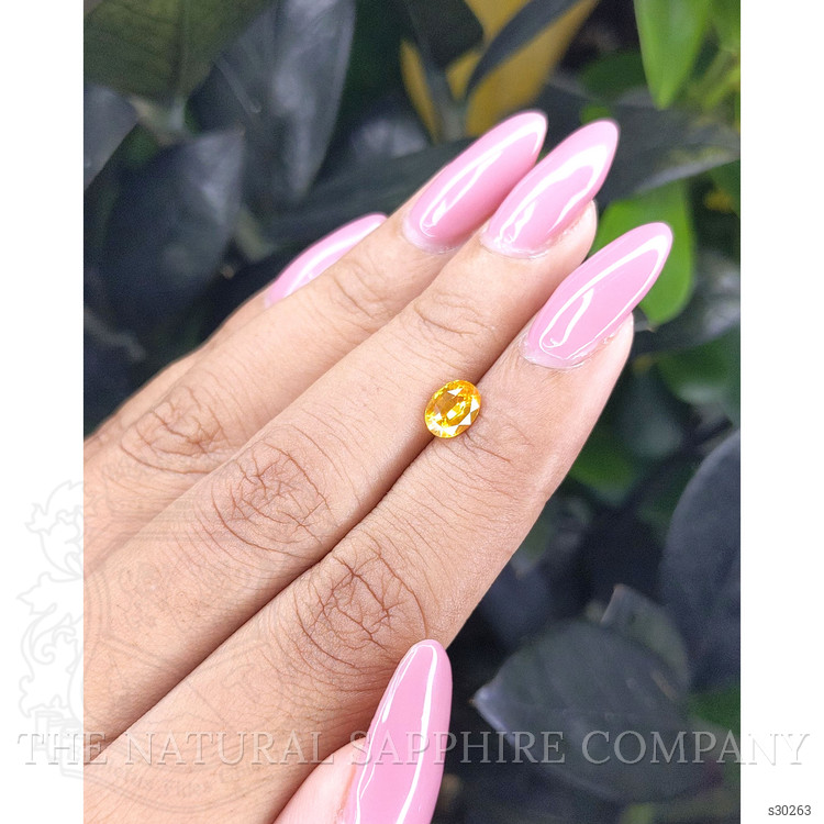 0.94 Ct. Orangish Yellow Sapphire from Ceylon (Sri Lanka)