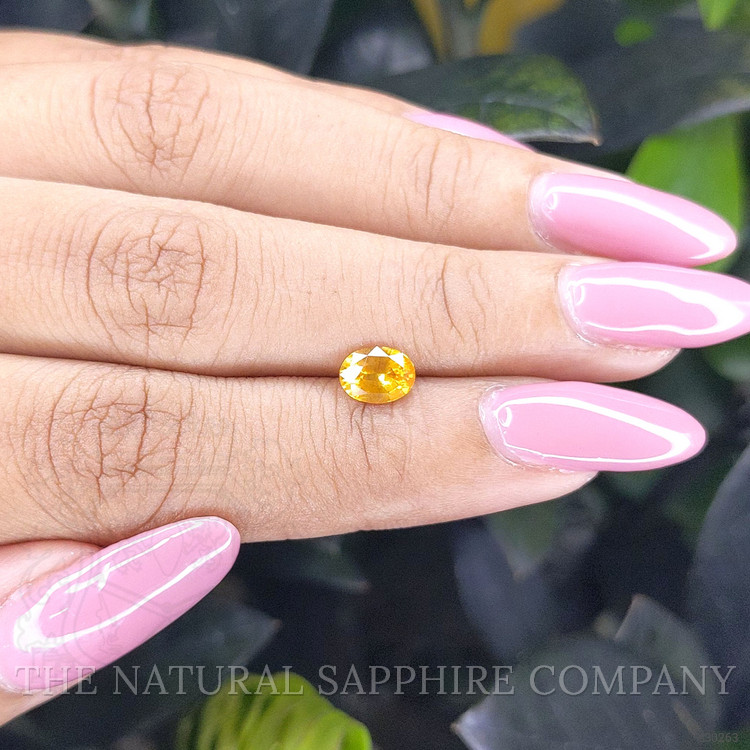 0.94 Ct. Orangish Yellow Sapphire from Ceylon (Sri Lanka)