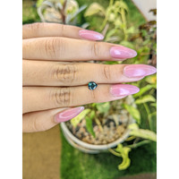 0.80 Ct. Greenish Blue Sapphire from Madagascar Life Style