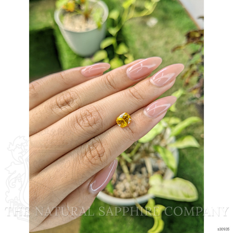 1.98 Ct. Orangish Yellow Sapphire from Ceylon (Sri Lanka)