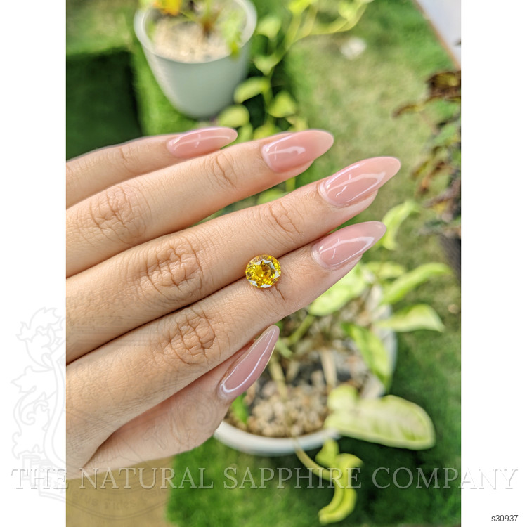 2.28 Ct. Orangish Yellow Sapphire from Ceylon (Sri Lanka)