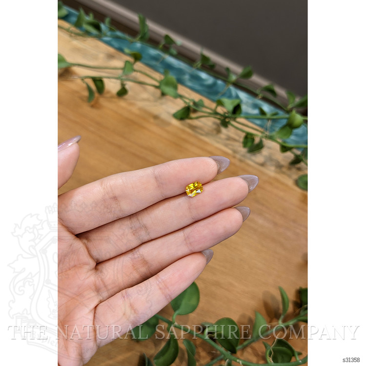 0.95 Ct. Orangish Yellow Sapphire from Ceylon (Sri Lanka)