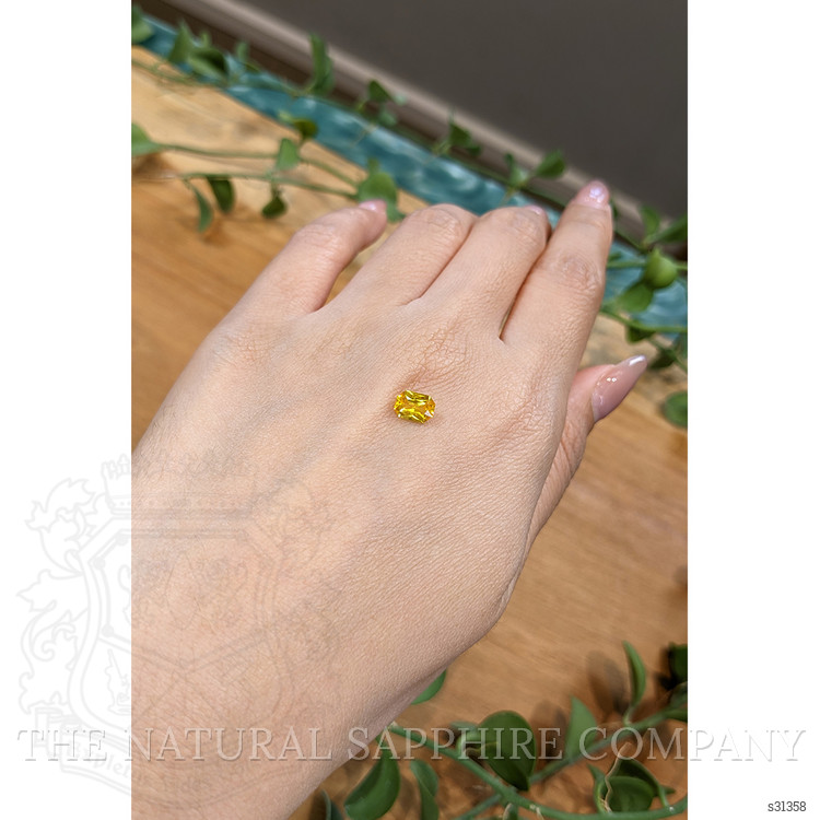 0.95 Ct. Orangish Yellow Sapphire from Ceylon (Sri Lanka)