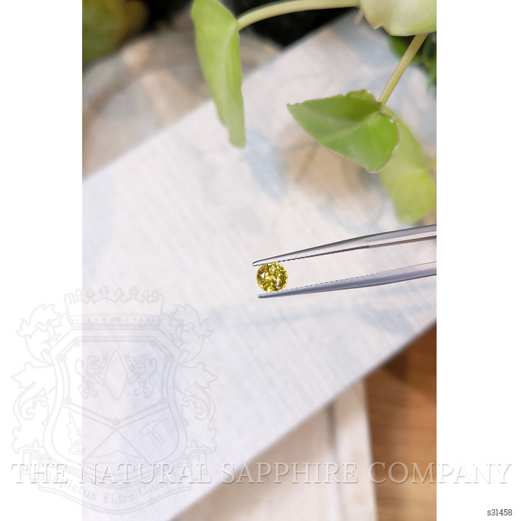 0.87 Ct. Orangish Yellow Sapphire from Ceylon (Sri Lanka)