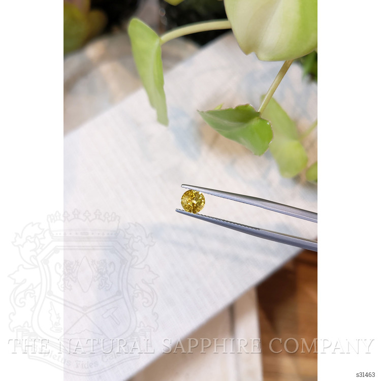 0.80 Ct. Orangish Yellow Sapphire from Ceylon (Sri Lanka)