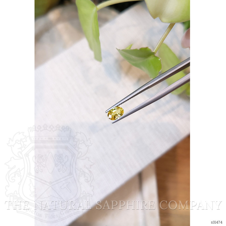 0.74 Ct. Orangish Yellow Sapphire from Ceylon (Sri Lanka)
