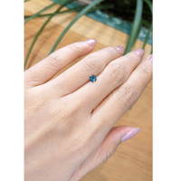 0.42 Ct. Greenish Blue Sapphire from Madagascar Life Style