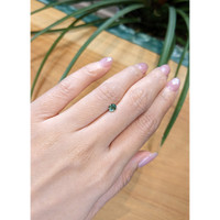 0.49 Ct. Bluish Green Sapphire from Madagascar Life Style