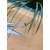 0.62 Ct. Bluish Green Sapphire from Madagascar Life Style