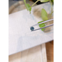 0.71 Ct. Greenish Blue Sapphire from Madagascar Life Style