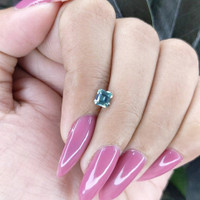 0.58 Ct. Bluish Green Sapphire from Madagascar Life Style