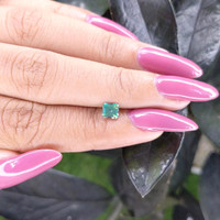 0.58 Ct. Bluish Green Sapphire from Madagascar Life Style