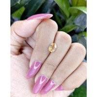 1.20 Ct. Orangish Yellow Sapphire from Madagascar Life Style