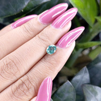 0.99 Ct. Greenish Blue Sapphire from Madagascar Life Style