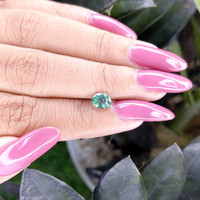 0.99 Ct. Greenish Blue Sapphire from Madagascar Life Style