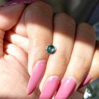 0.99 Ct. Bluish Green Sapphire from Madagascar Life Style