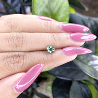 0.99 Ct. Bluish Green Sapphire from Madagascar Life Style