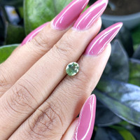 0.99 Ct. Yellowish Green Sapphire from Madagascar Life Style