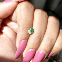 0.99 Ct. Yellowish Green Sapphire from Madagascar Life Style