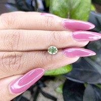 0.99 Ct. Yellowish Green Sapphire from Madagascar Life Style