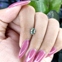 0.99 Ct. Bluish Green Sapphire from Madagascar Life Style