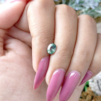 0.98 Ct. Bluish Green Sapphire from Madagascar Life Style