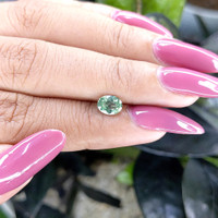 0.98 Ct. Bluish Green Sapphire from Madagascar Life Style