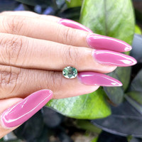 1.03 Ct. Yellowish Green Sapphire from Madagascar Life Style