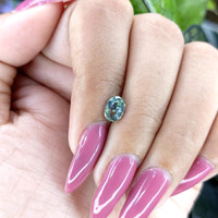 0.98 Ct. Bluish Green Sapphire from Madagascar Life Style
