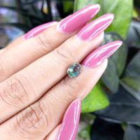 0.98 Ct. Bluish Green Sapphire from Madagascar Life Style