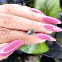 0.98 Ct. Bluish Green Sapphire from Madagascar Life Style