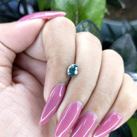 0.98 Ct. Bluish Green Sapphire from Madagascar Life Style