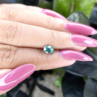 0.98 Ct. Bluish Green Sapphire from Madagascar Life Style